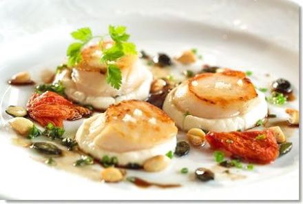 Grilled Scallops with Cauliflower Purée, Confit Tomatoes and Hazelnut Vinaigrette
